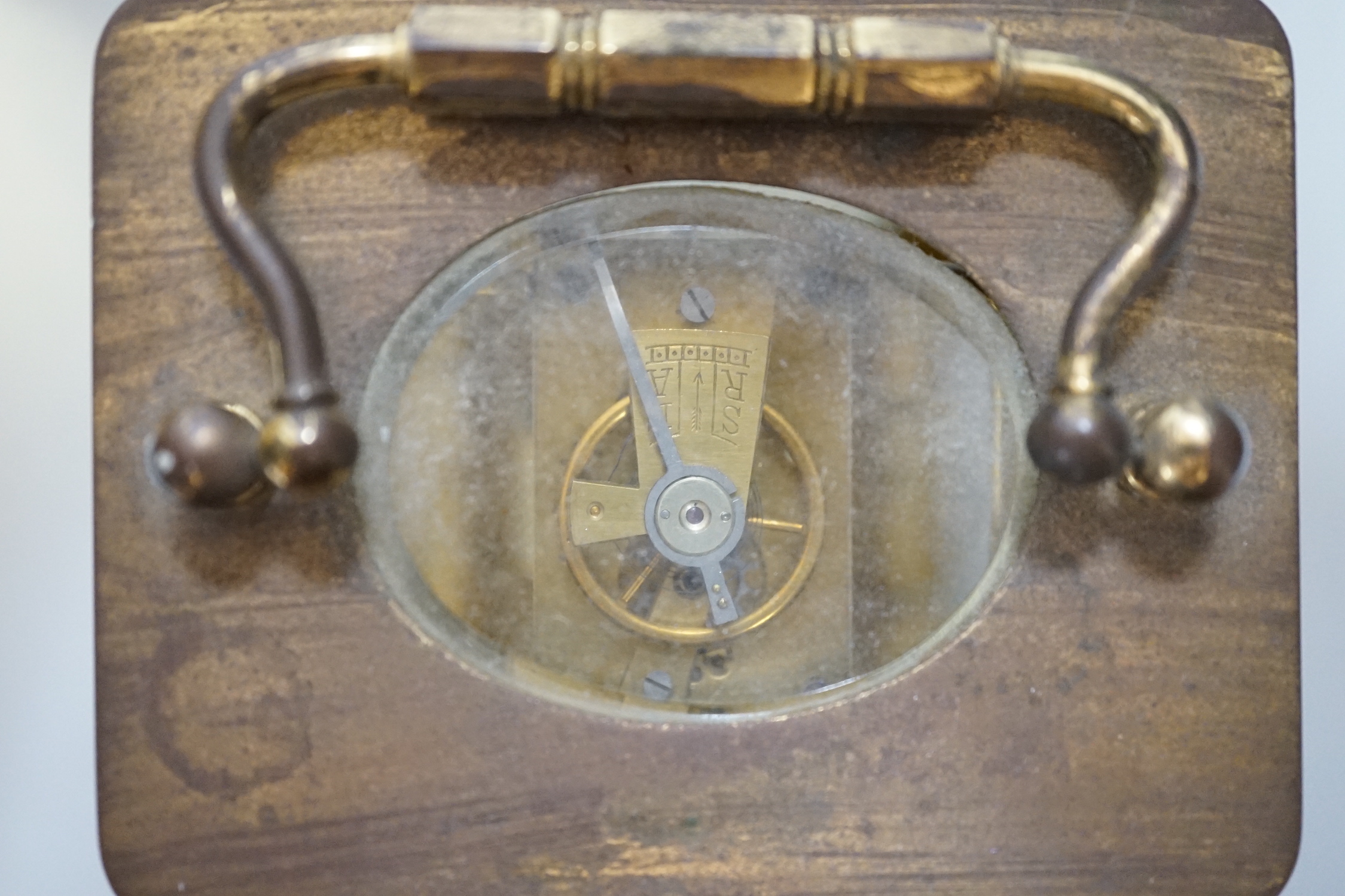 Two carriage timepieces comprising a brass example and one green onyx mounted with quartz movement, largest 17cm high